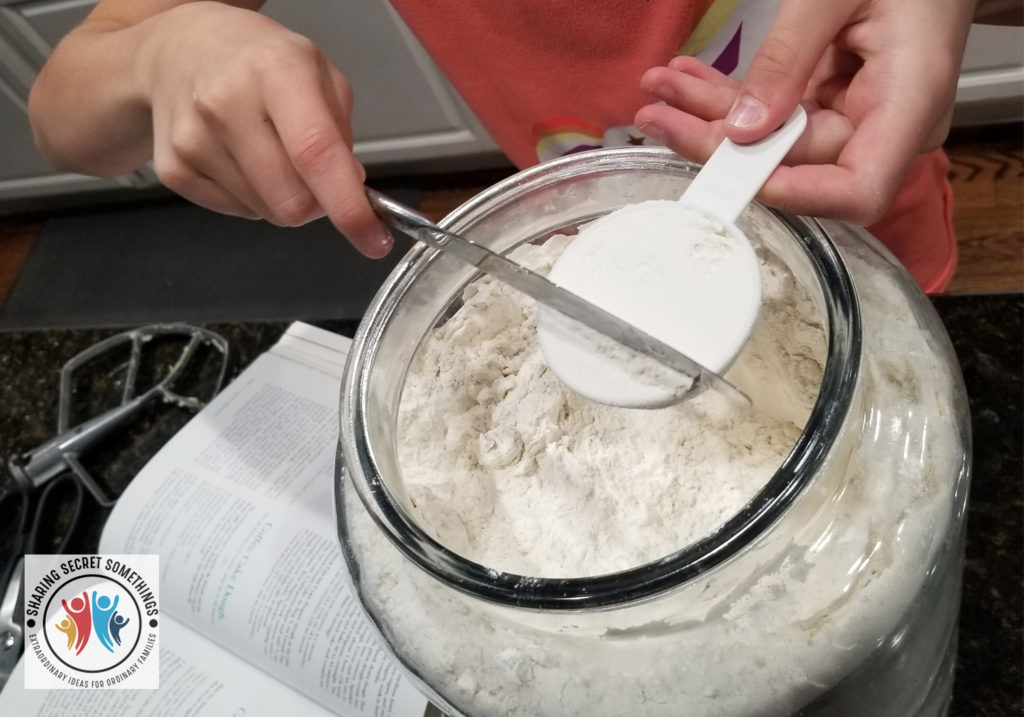 Teaching a child to measure the flour