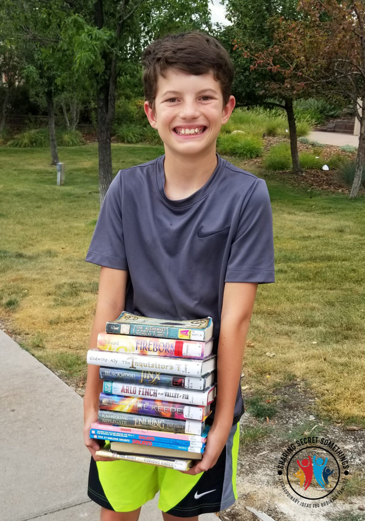 Jr. High Carrying a stack of books
